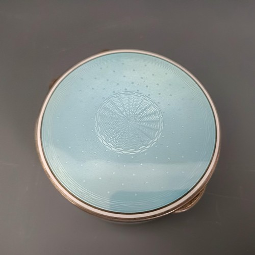 454 - A Continental silver coloured metal and blue enamel circular box, all in 170 g