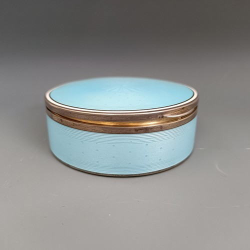 454 - A Continental silver coloured metal and blue enamel circular box, all in 170 g