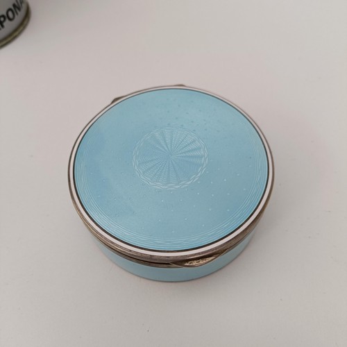 454 - A Continental silver coloured metal and blue enamel circular box, all in 170 g