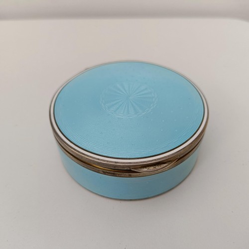 454 - A Continental silver coloured metal and blue enamel circular box, all in 170 g