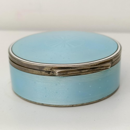 454 - A Continental silver coloured metal and blue enamel circular box, all in 170 g