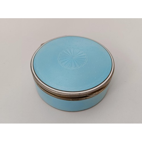 454 - A Continental silver coloured metal and blue enamel circular box, all in 170 g