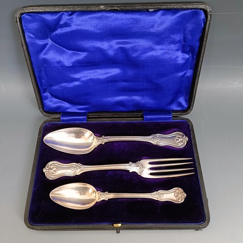 435 - A French silver coloured metal Christening set, comprising a fork, spoon and a teaspoon, cased