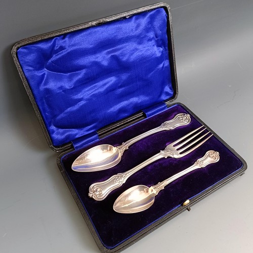 435 - A French silver coloured metal Christening set, comprising a fork, spoon and a teaspoon, cased