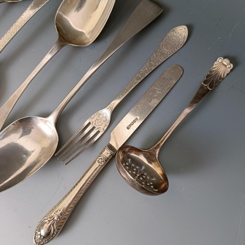 442 - A George III Old English pattern serving spoon, four other spoons, a fork, a ladle, 11.1 ozt and a s... 