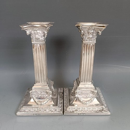 444 - A pair of late Victorian silver candlesticks, in the form of Corinthian columns, Sheffield 1901, bas... 