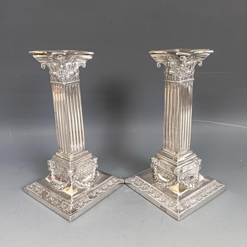 444 - A pair of late Victorian silver candlesticks, in the form of Corinthian columns, Sheffield 1901, bas... 