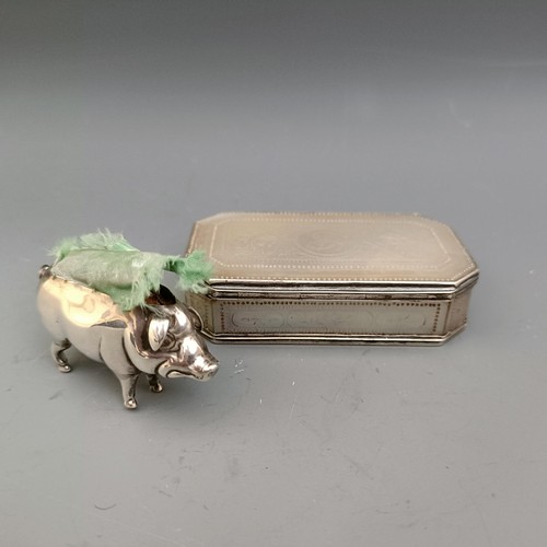 558 - A 19th century, mother of pearl and silver coloured metal snuff box, and a silver mounted pin cushio... 