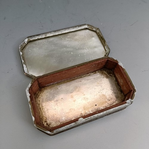 558 - A 19th century, mother of pearl and silver coloured metal snuff box, and a silver mounted pin cushio... 