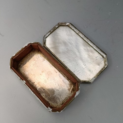 558 - A 19th century, mother of pearl and silver coloured metal snuff box, and a silver mounted pin cushio... 