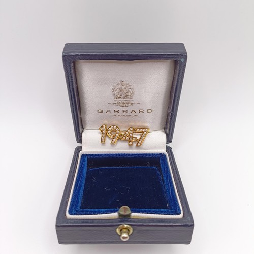 37 - An 18ct gold and diamond 1947 brooch, by Garrard & Co, in a later Garrard & Co box