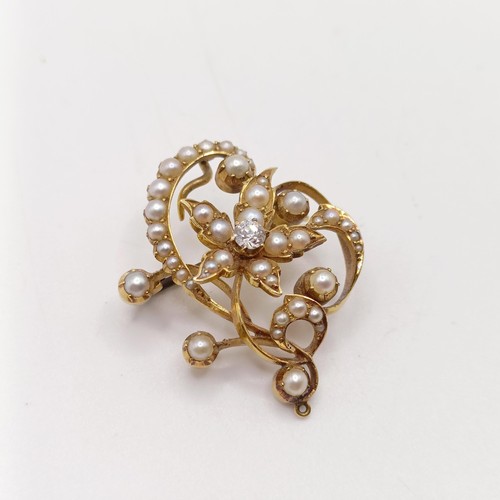 66 - ***Withdrawn*** A diamond and pearl floral brooch