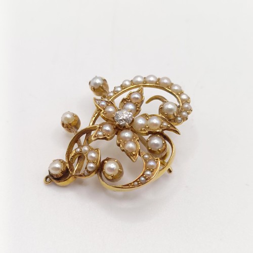 66 - ***Withdrawn*** A diamond and pearl floral brooch