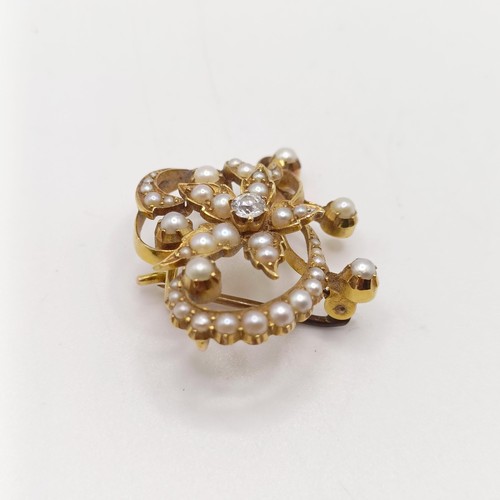 66 - ***Withdrawn*** A diamond and pearl floral brooch