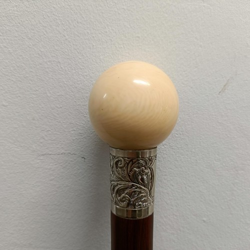 566 - A 19th century rosewood and ivory walking stick, with a silver coloured metal collar, 97 cm, Ivory E... 