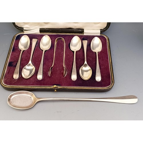 573 - A George V silver egg cup, a set of six teaspoons, with matching sugar tongs, cased, and a spoon, 6 ... 