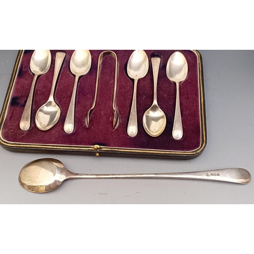 573 - A George V silver egg cup, a set of six teaspoons, with matching sugar tongs, cased, and a spoon, 6 ... 