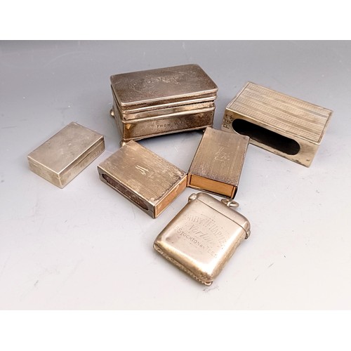 577 - A George V silver ring box, Birmingham 1914, a pill box, three matchbox holders, and a vesta