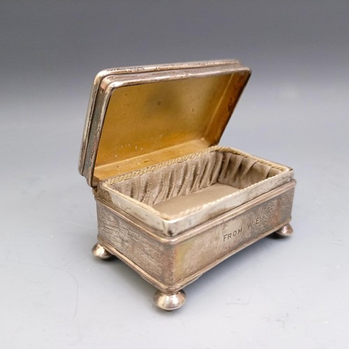 577 - A George V silver ring box, Birmingham 1914, a pill box, three matchbox holders, and a vesta