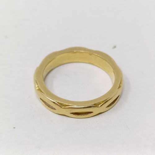 171 - A yellow coloured metal wedding style band, ring size M 1/2