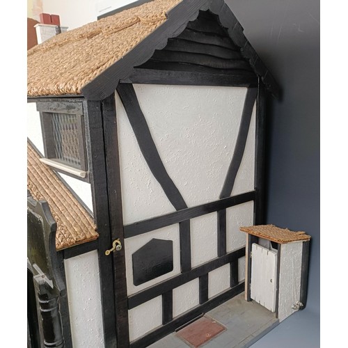 851 - An unusual doll's house, in the form of the pub called The Pig and Whistle, in the Tudor style, with... 