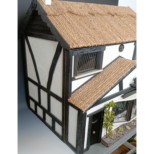 851 - An unusual doll's house, in the form of the pub called The Pig and Whistle, in the Tudor style, with... 