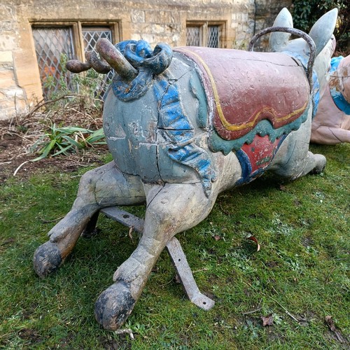 834 - A late 19th/early 20th century large carved and painted wood double seat carousel pig, 140 cm wide  ... 