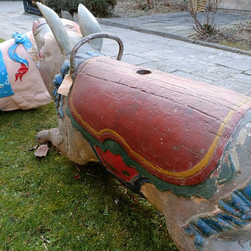 834 - A late 19th/early 20th century large carved and painted wood double seat carousel pig, 140 cm wide  ... 