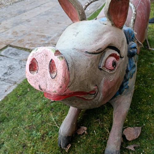 834 - A late 19th/early 20th century large carved and painted wood double seat carousel pig, 140 cm wide  ... 