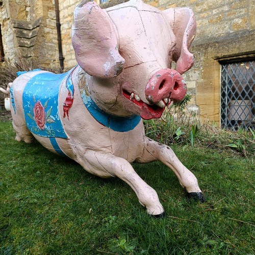 833 - A 19th century carved and painted Bayol carousel pig, 143 cm wide
Provenance: Purchased from The Tus... 