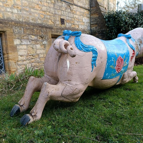 833 - A 19th century carved and painted Bayol carousel pig, 143 cm wide
Provenance: Purchased from The Tus... 