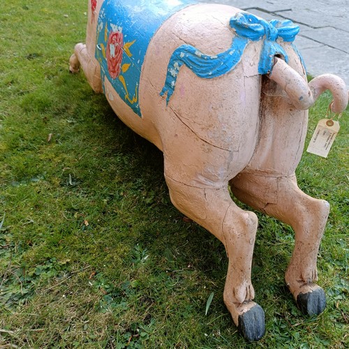 833 - A 19th century carved and painted Bayol carousel pig, 143 cm wide
Provenance: Purchased from The Tus... 