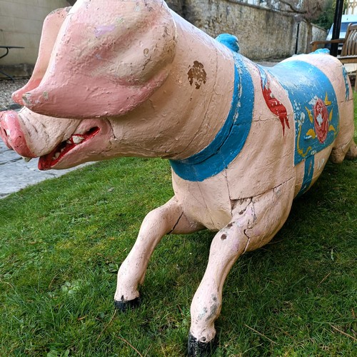 833 - A 19th century carved and painted Bayol carousel pig, 143 cm wide
Provenance: Purchased from The Tus... 