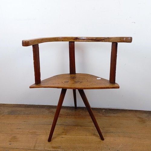 877 - A child's primitive/country made chair, of triangular form on three legs