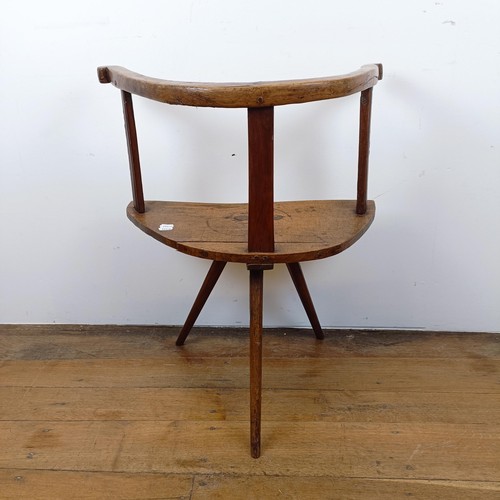 877 - A child's primitive/country made chair, of triangular form on three legs