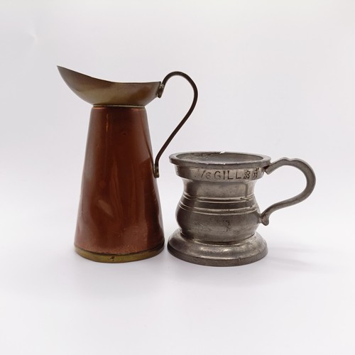 819 - A pewter drinking vessel, with a brass and copper jug (2)