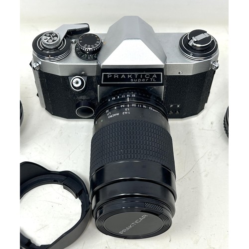 765 - A Praktica Super TL camera, and two lenses, cased