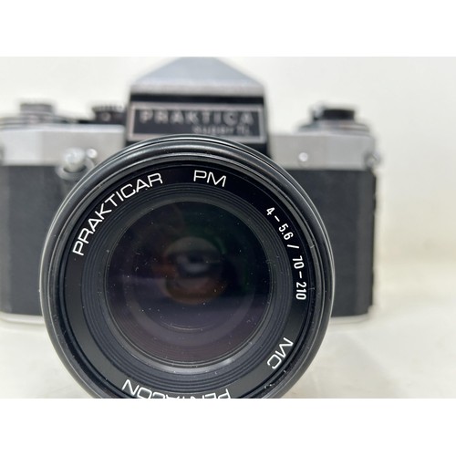 765 - A Praktica Super TL camera, and two lenses, cased