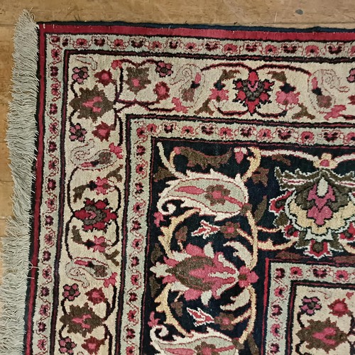 956 - An antique Persian handmade Dorokhsh carpet, 403 x 305