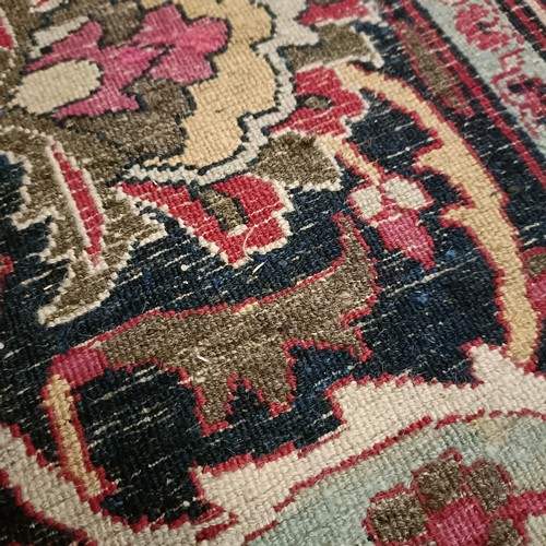 956 - An antique Persian handmade Dorokhsh carpet, 403 x 305