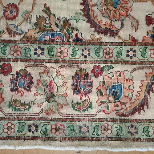 961 - A Persian handmade Tabriz carpet, 290 x 192 cm