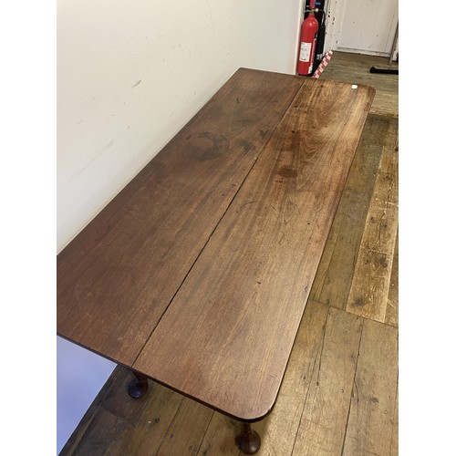 937 - A 19th century mahogany side table, with single drawer to the side on carved cabriole legs to pad fe... 