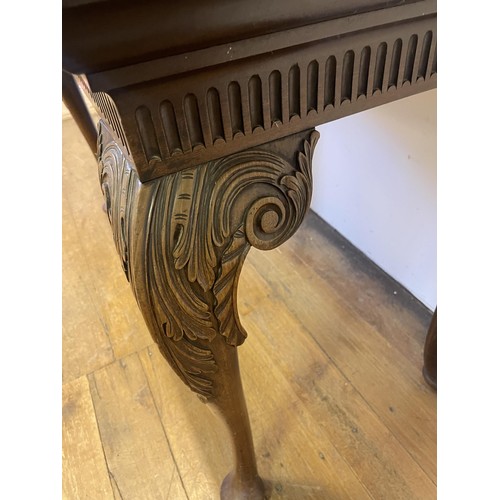 937 - A 19th century mahogany side table, with single drawer to the side on carved cabriole legs to pad fe... 