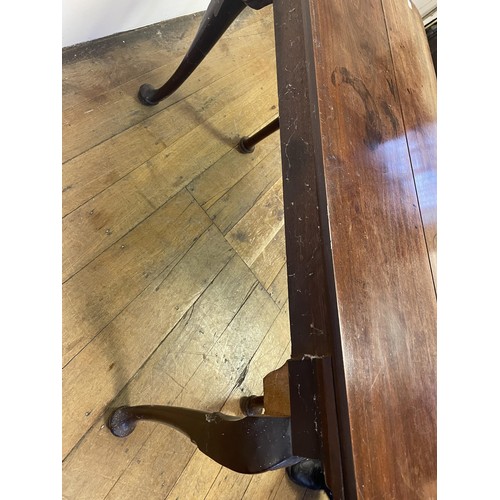 937 - A 19th century mahogany side table, with single drawer to the side on carved cabriole legs to pad fe... 