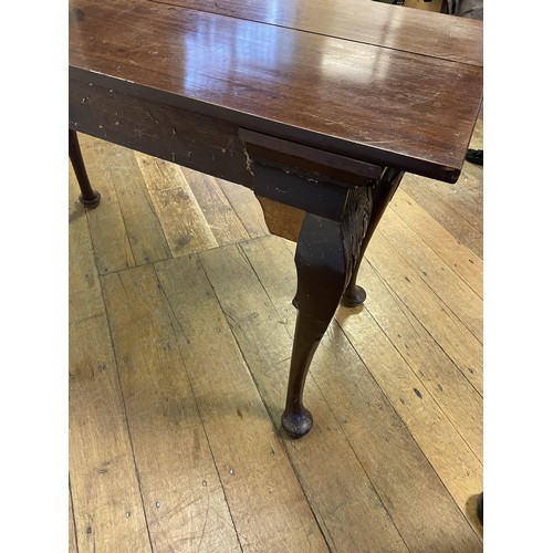 937 - A 19th century mahogany side table, with single drawer to the side on carved cabriole legs to pad fe... 