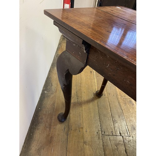 937 - A 19th century mahogany side table, with single drawer to the side on carved cabriole legs to pad fe... 