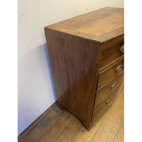 883 - A 19th century bow front mahogany chest, having two short and three long drawers, 103 cm wide