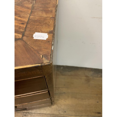 883 - A 19th century bow front mahogany chest, having two short and three long drawers, 103 cm wide