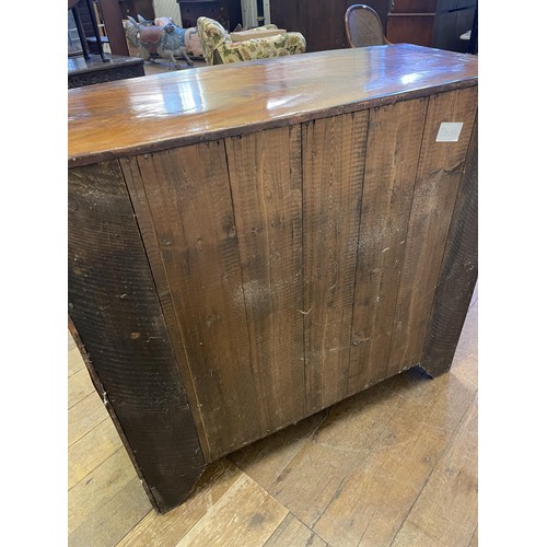 883 - A 19th century bow front mahogany chest, having two short and three long drawers, 103 cm wide