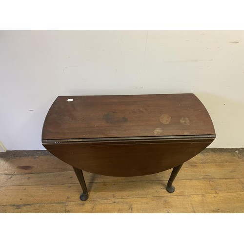 884 - A mahogany drop leaf table, 85 cm wide, a Sutherland table, a bedroom mirror, a wine table, and a si... 